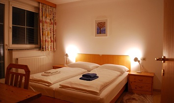 One of the two double rooms in the Classic apartment with balcony